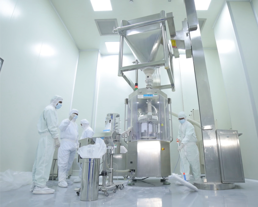 Operators in a controlled cleanroom production environment
